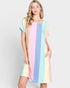 Woman wearing a pastel striped dress on a light gray background