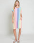 Woman wearing a colorful striped dress on a plain background