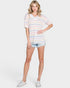 Woman wearing a striped t-shirt and denim shorts on a white background