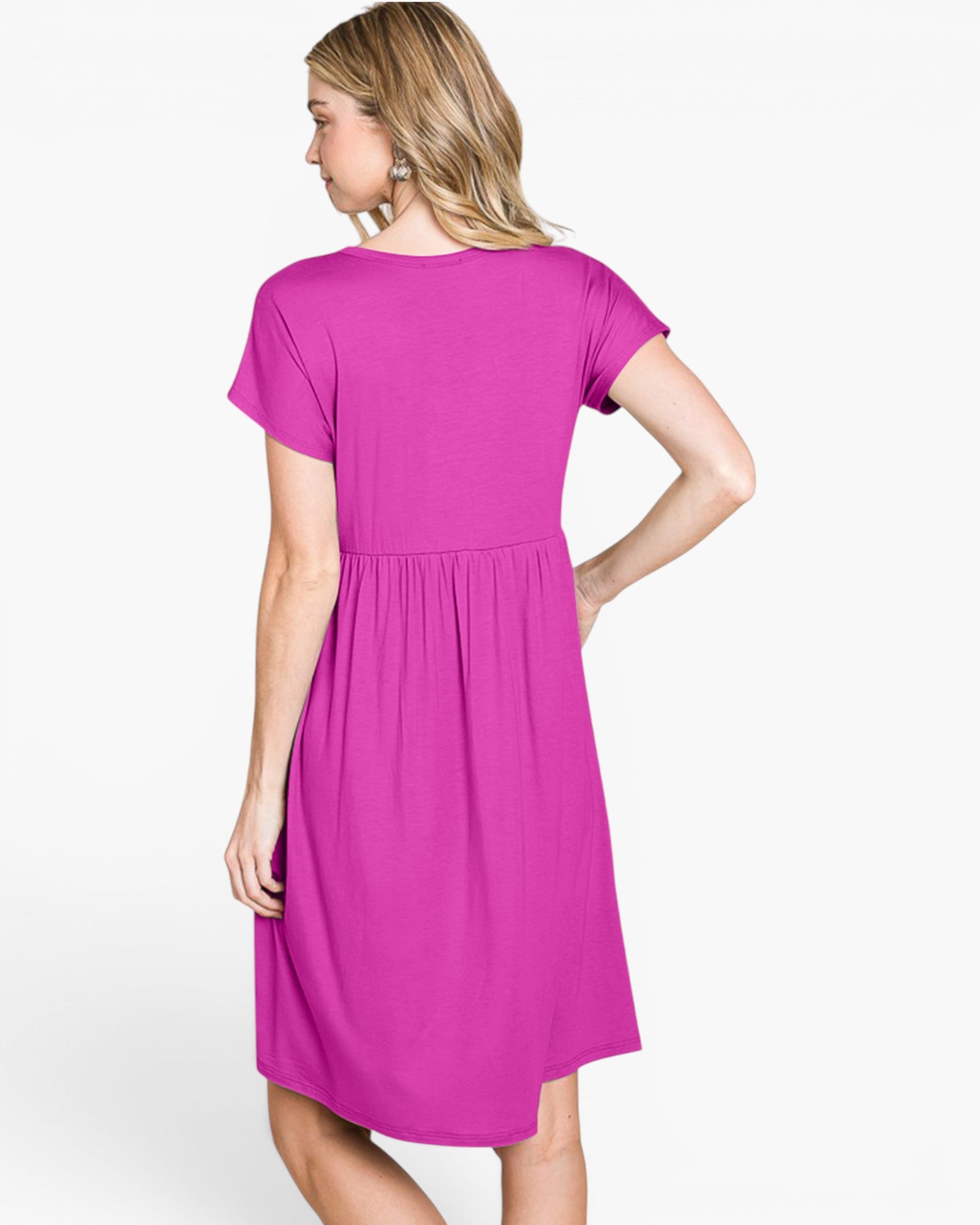A woman wearing a bright magenta short-sleeve dress, shown from the back against a plain white studio background.