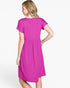 A woman wearing a bright magenta short-sleeve dress, shown from the back against a plain white studio background.