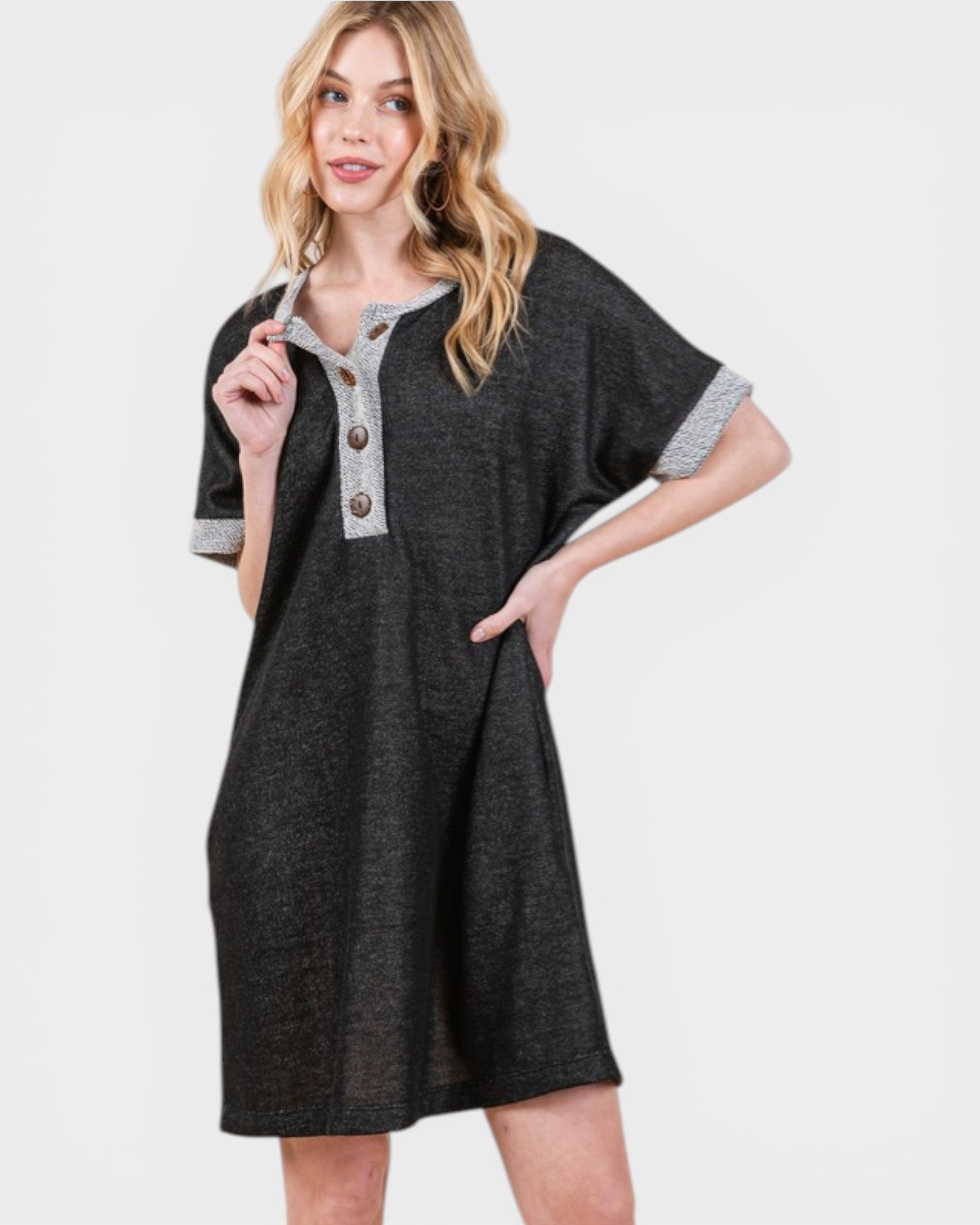 Woman wearing a dark gray dress with a white background