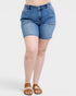 Person wearing blue denim shorts on a white background