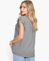 A woman wearing a heather gray short-sleeve top with ruffle details on the sleeves, shown from a side-back angle against a plain white background.