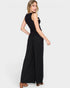 Woman wearing a black jumpsuit on a white background