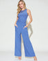 Woman wearing a blue jumpsuit on a white background