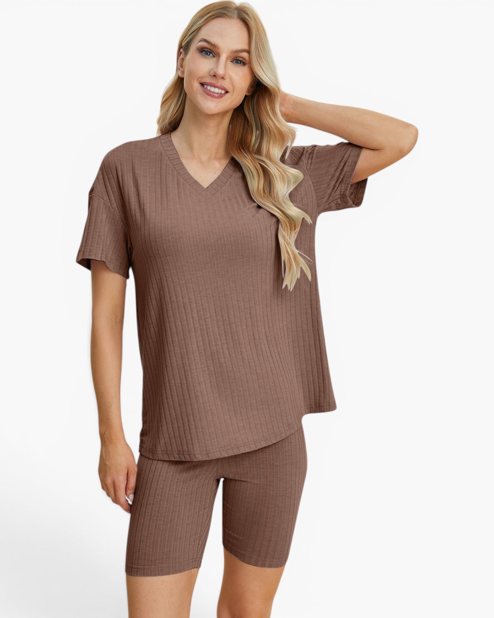 A woman modeling a matching ribbed two-piece loungewear set in a dusty brown color, featuring a short-sleeve V-neck top and matching fitted shorts, against a plain white studio background.