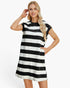 A woman modeling a short-sleeve, knee-length tunic dress with bold horizontal black and off-white stripes against a plain white studio background.
