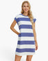 A woman modeling a short-sleeve tunic dress with horizontal blue and white stripes, set against a plain white studio background.