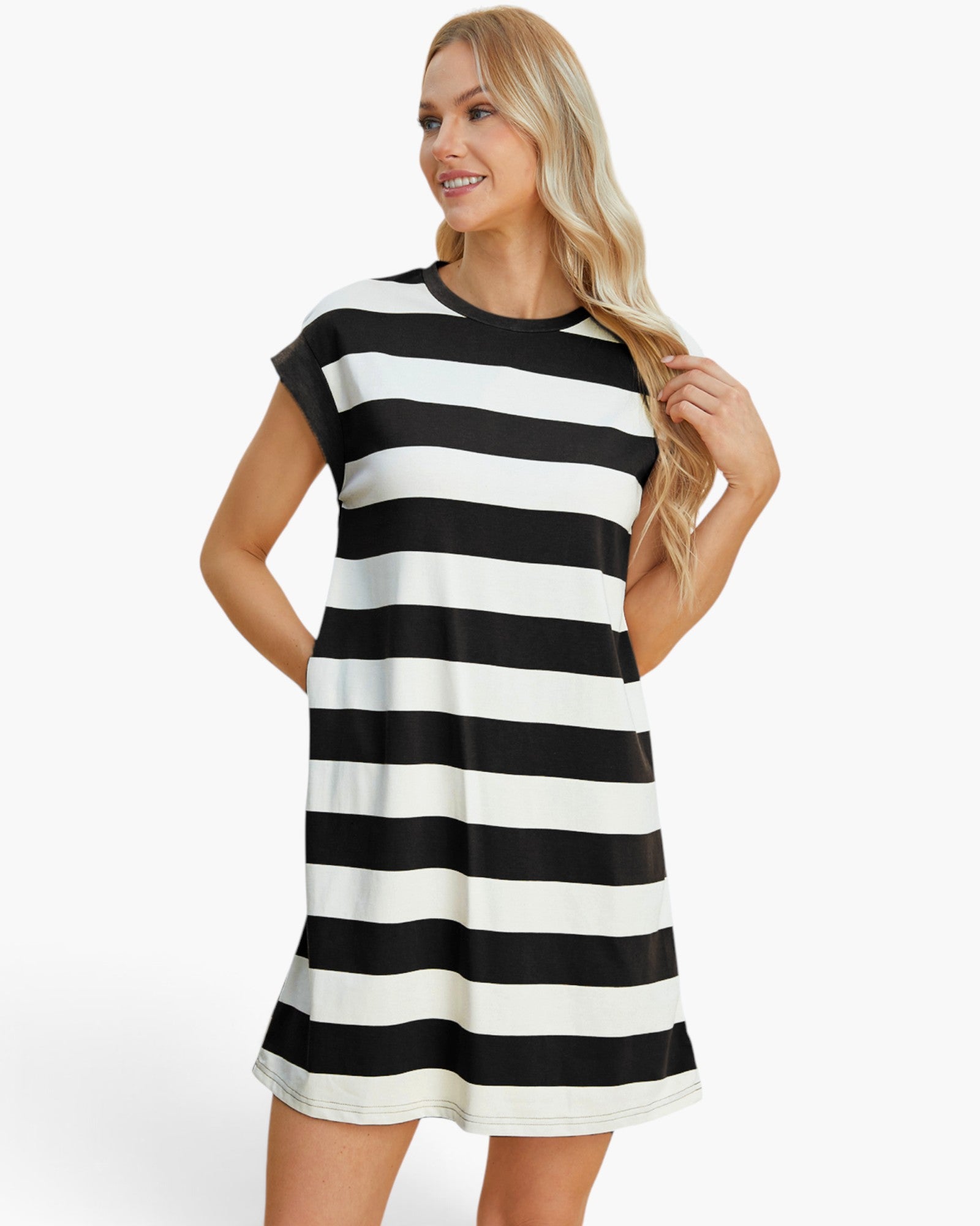 A woman modeling a short-sleeve, A-line mini dress with horizontal black and off-white stripes against a plain white studio background.