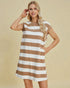 Woman wearing a brown and white striped dress against a beige background