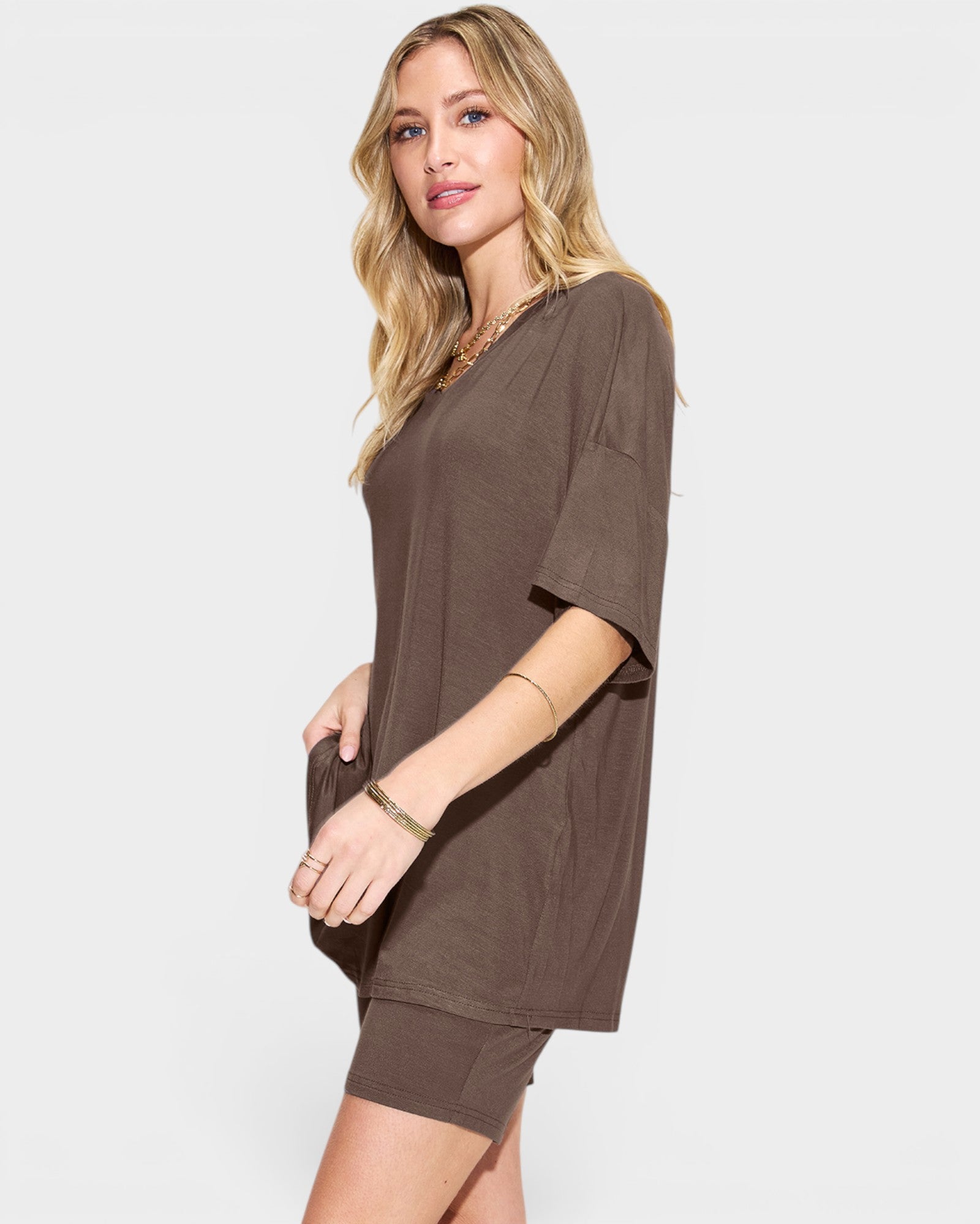 Woman wearing a brown outfit on a white background