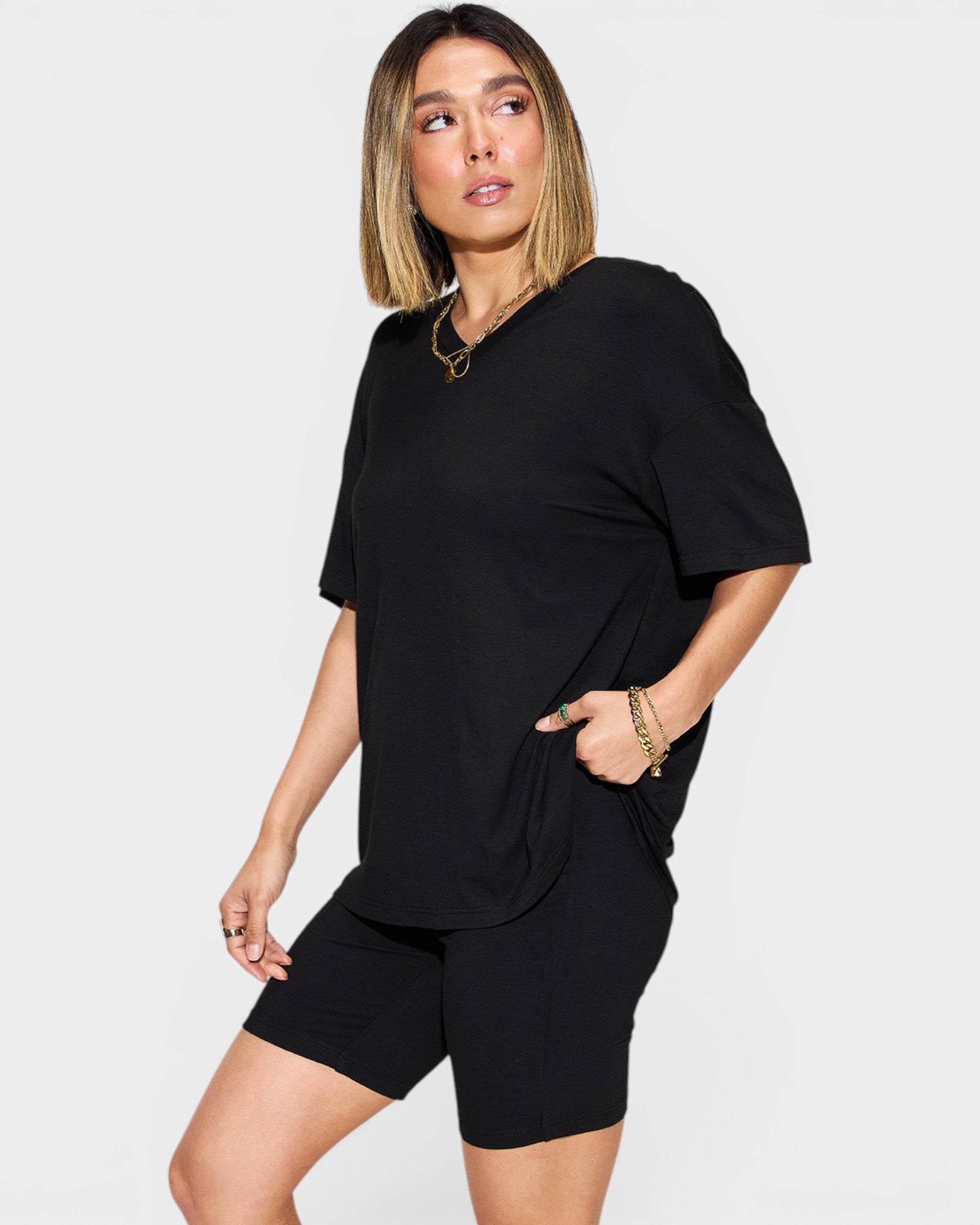 Woman wearing a black outfit on a white background