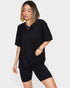 Woman wearing a black outfit on a white background