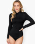 A woman modeling a black long-sleeve mock neck bodysuit against a plain white background.