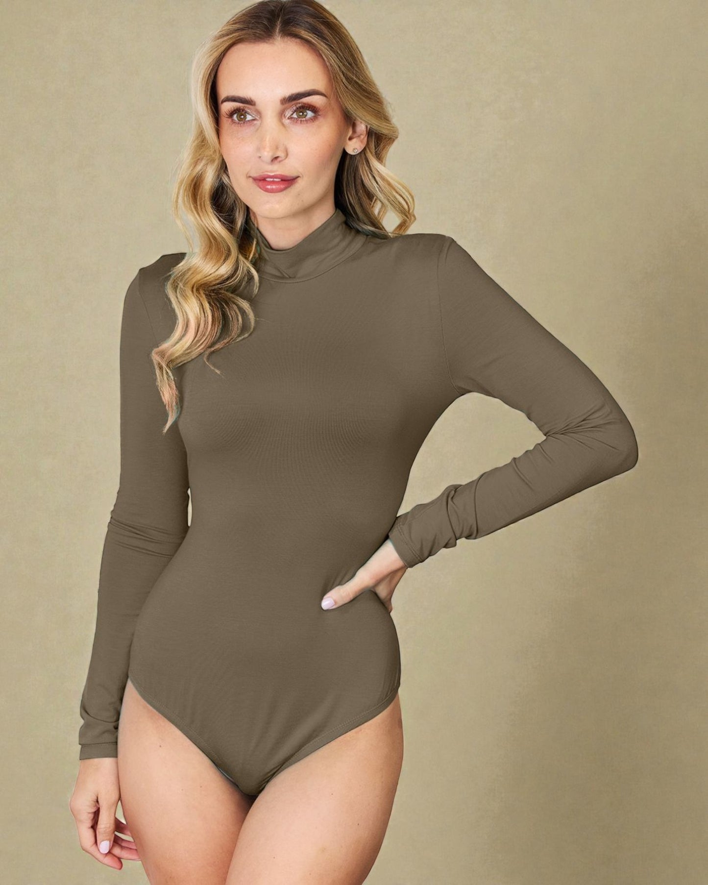 Woman wearing a brown bodysuit against a beige background