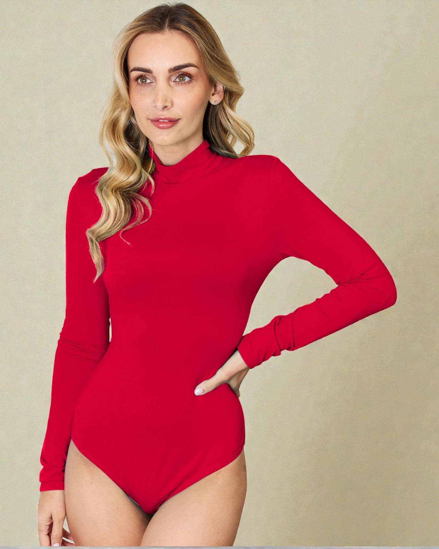 Woman wearing a red long-sleeve bodysuit against a beige background