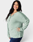 Woman wearing a green ribbed sweater on a white background
