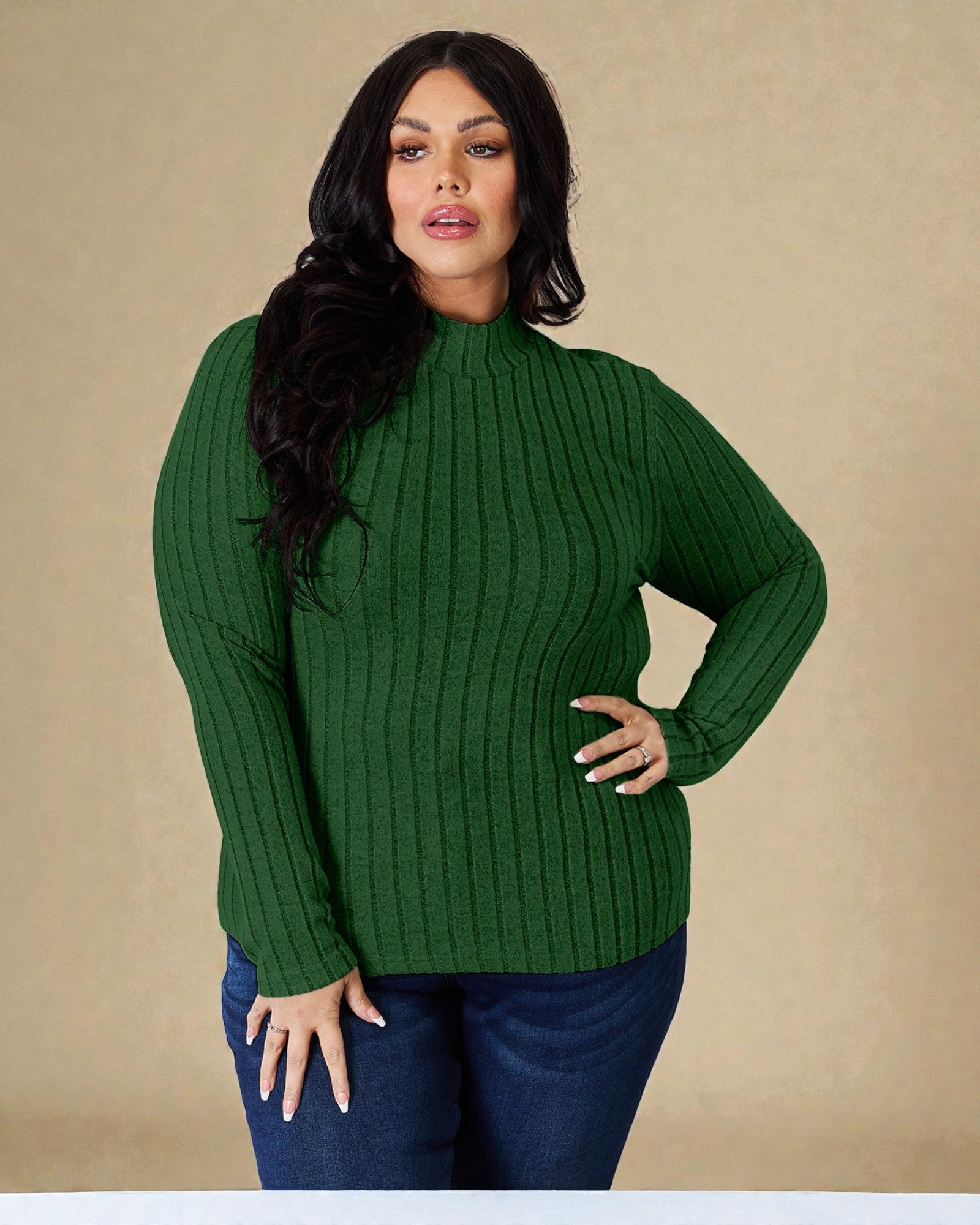 Woman wearing a green ribbed sweater against a beige background