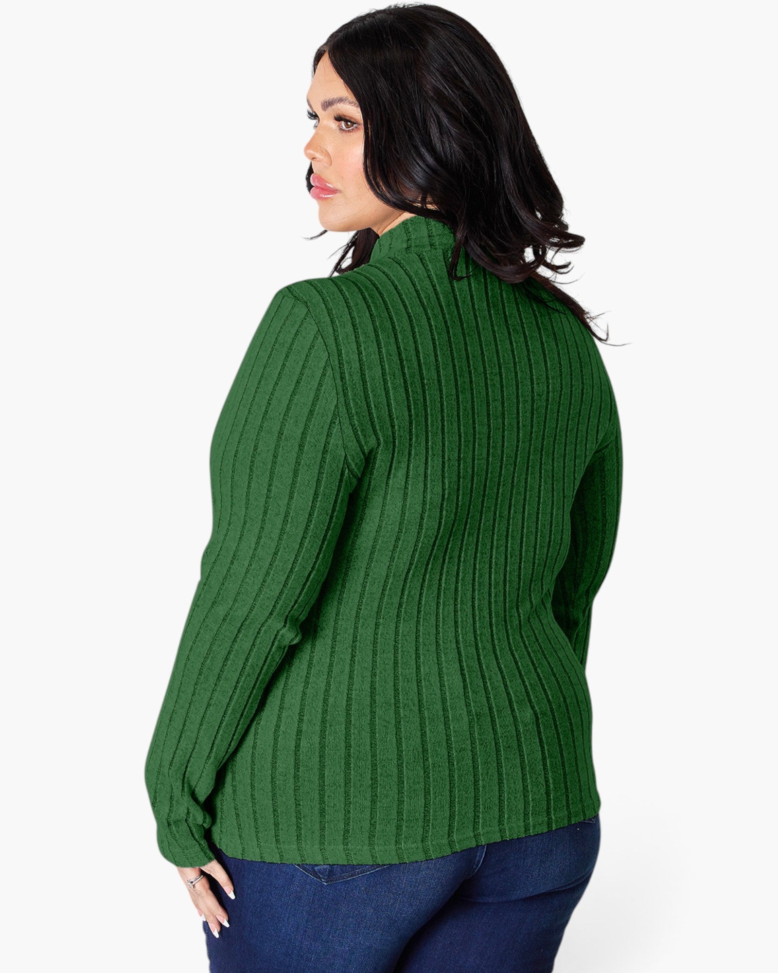 A woman wearing a green ribbed knit mock neck sweater, shown from a three-quarter back angle against a plain white background.