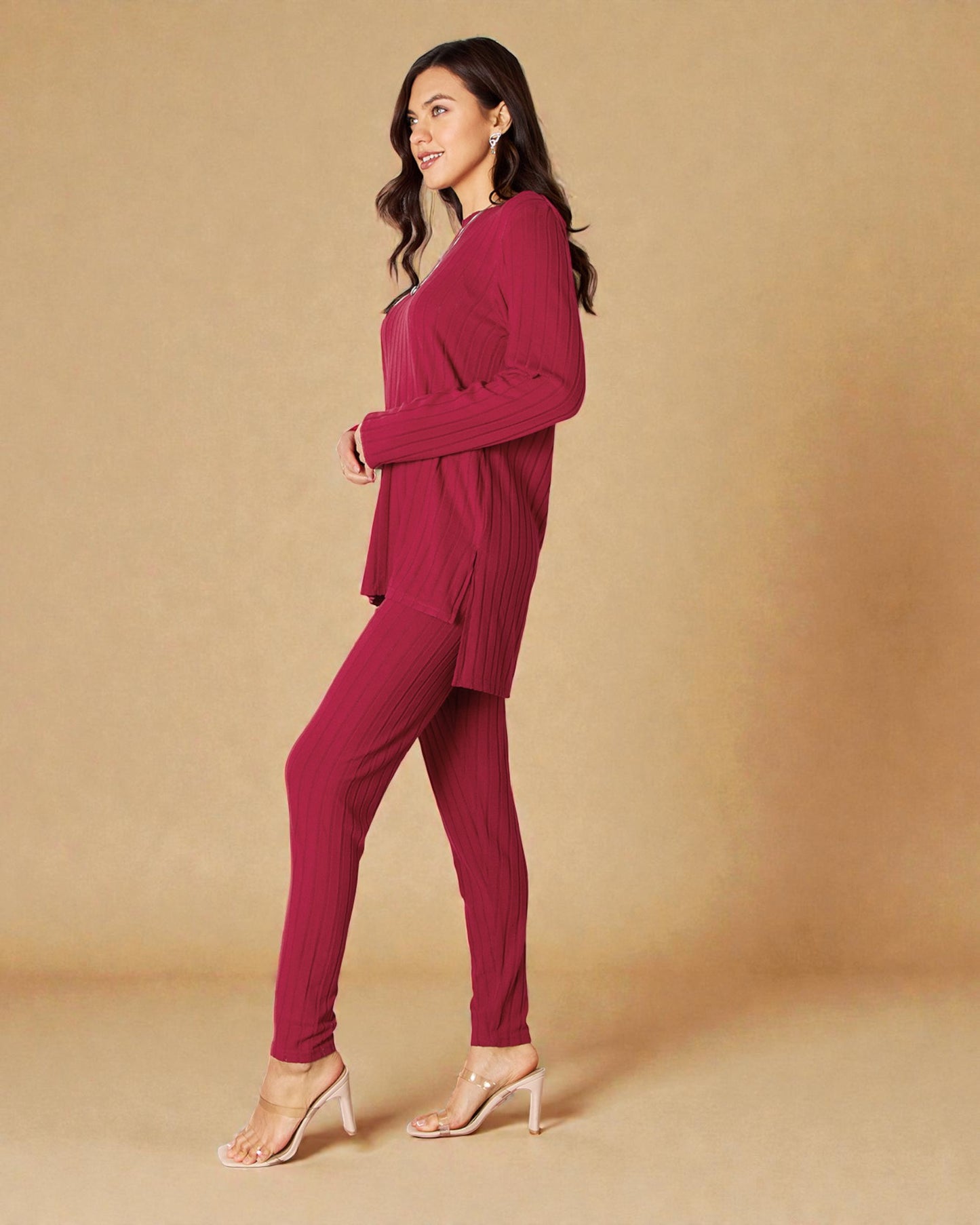 Woman wearing a maroon outfit on a beige background