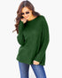 A woman wearing a dark green ribbed knit long-sleeve sweater and blue jeans, posing against a light gray background.