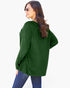 A woman wearing a dark green ribbed knit sweater and blue jeans, photographed from the back against a plain white background.