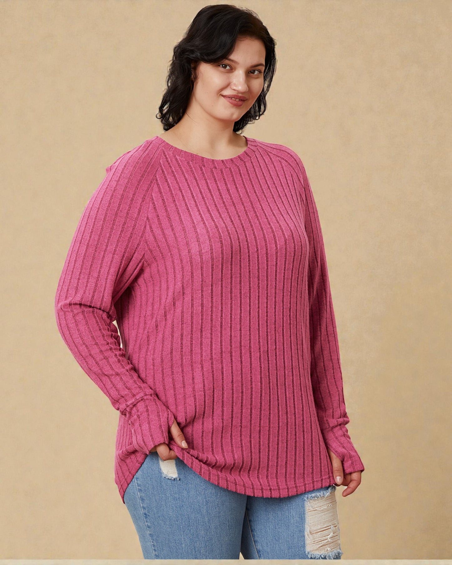 Woman wearing a pink ribbed sweater against a beige background