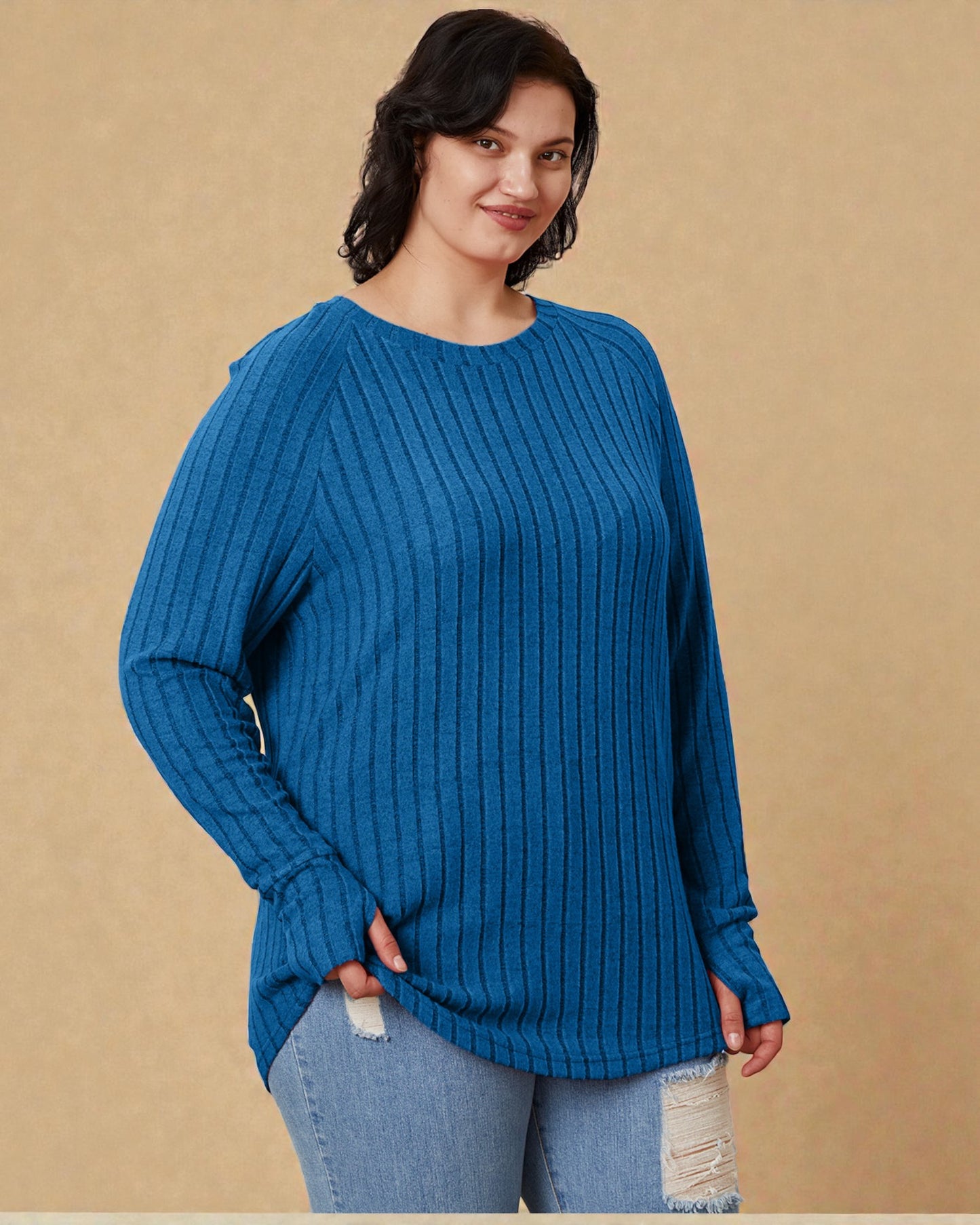 Woman wearing a blue sweater against a beige background