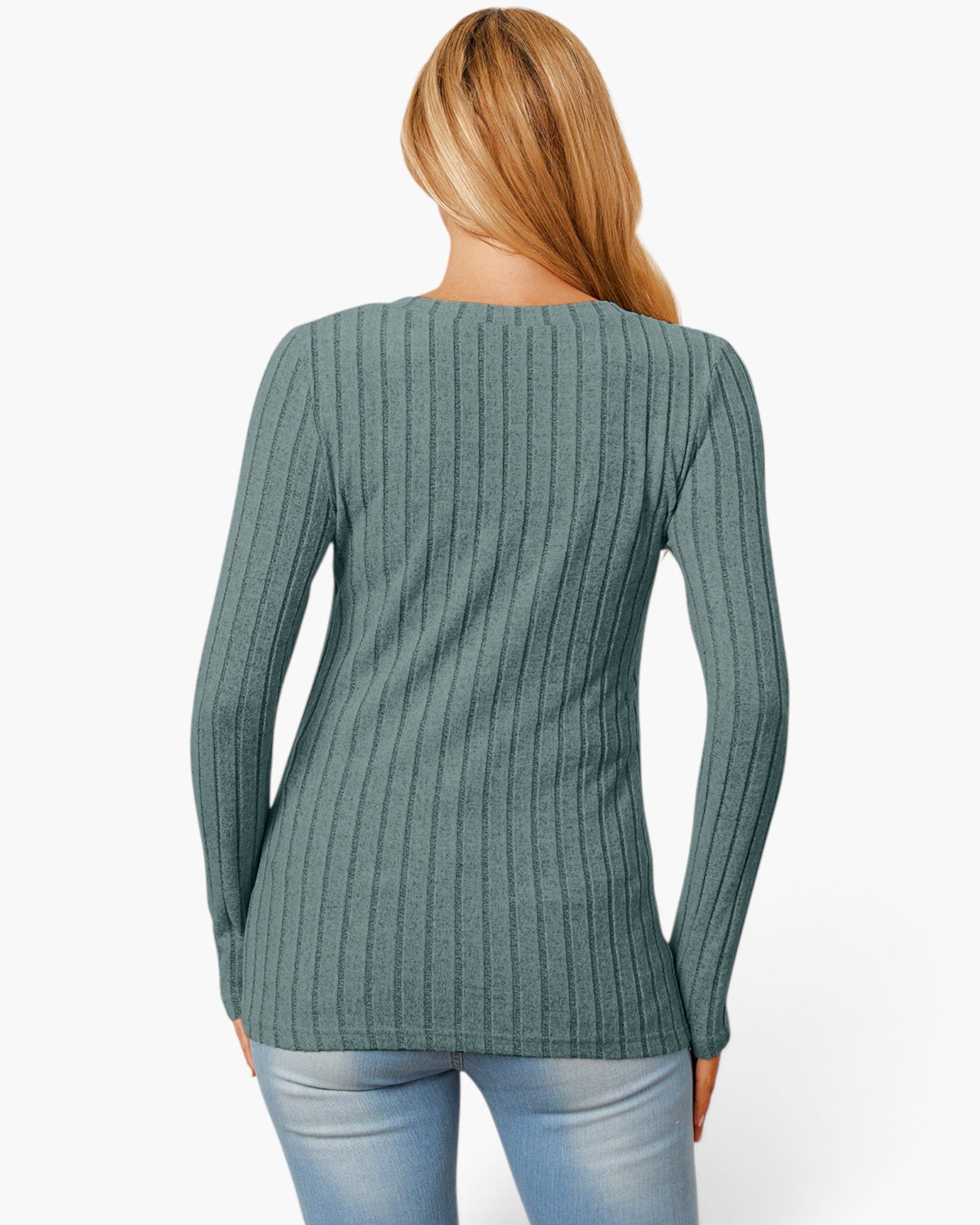 A woman shown from the back wearing a ribbed long-sleeve knit top in a muted sage green color, paired with light blue jeans, against a plain white background.