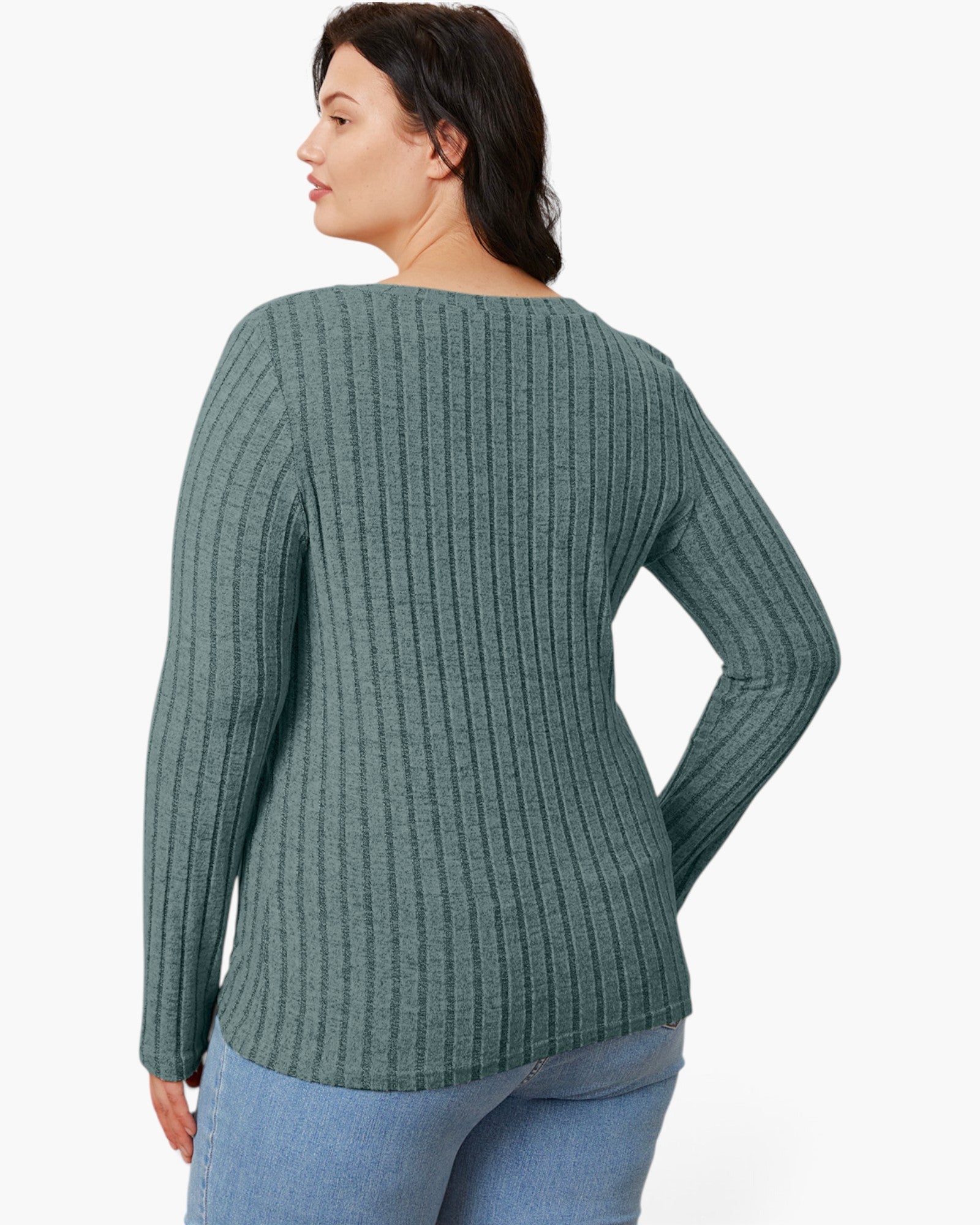 A woman shown from the back wearing a ribbed knit long-sleeve top in a muted sage green color, paired with light blue jeans, against a plain white background.