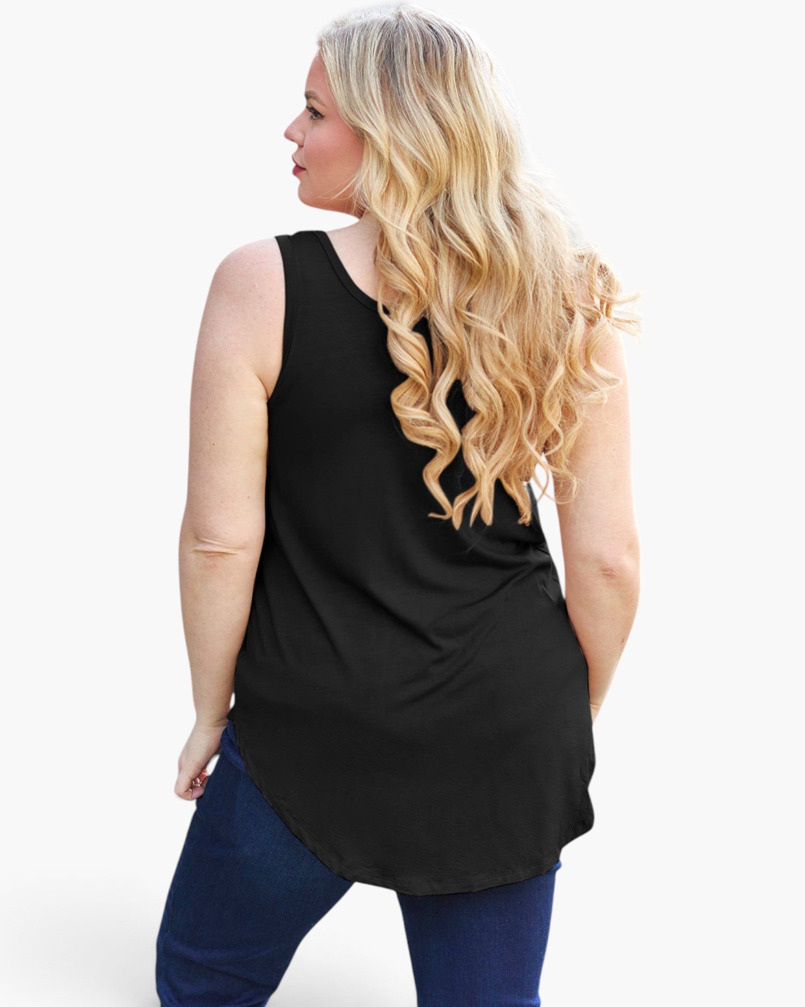 A woman with long, wavy blonde hair is shown from the back wearing a black sleeveless tunic top and blue jeans against a plain white background.