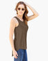 A woman modeling a sleeveless scoop-neck tank top in a solid dark brown color, paired with blue jeans and gold-framed sunglasses, against a plain white background.
