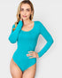 Woman wearing a teal long-sleeve bodysuit on a white background