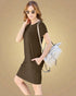 Woman wearing a brown dress with sunglasses and carrying a white backpack on a beige background