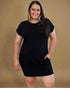 Woman wearing a black dress against a brown background