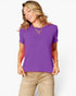 A woman wearing a purple short-sleeve crewneck t-shirt and beige pants, posing against a light gray background.