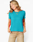 A woman wearing a bright turquoise short-sleeve crewneck t-shirt and beige pants, posing against a light gray studio background.