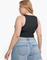 A woman shown from the back wearing a black sleeveless crop top and light blue denim shorts against a plain white background.