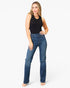 A woman modeling a pair of high-waisted, straight-leg blue jeans with a black sleeveless top, standing against a plain white studio background.