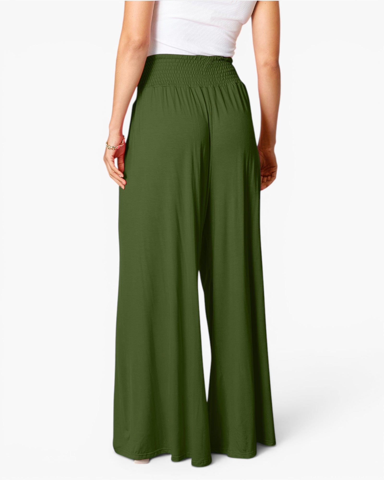 A model shown from the back wearing high-waisted, wide-leg pants in olive green, paired with a white top, against a clean white studio background.