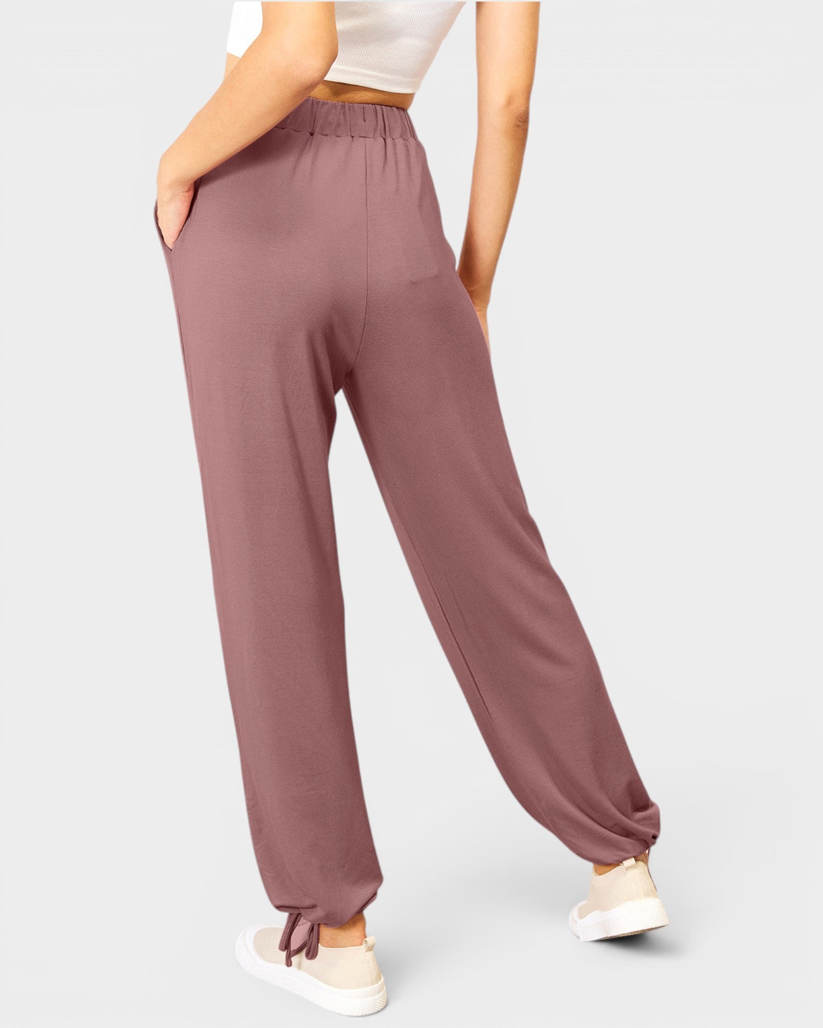 Mauve pants worn by a person on a light gray background