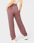 Mauve pants worn by a person on a light gray background