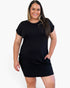 A woman modeling a black short-sleeve bodycon mini dress against a plain light gray background.