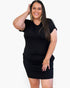 A woman modeling a black short-sleeve bodycon mini dress against a plain white background.