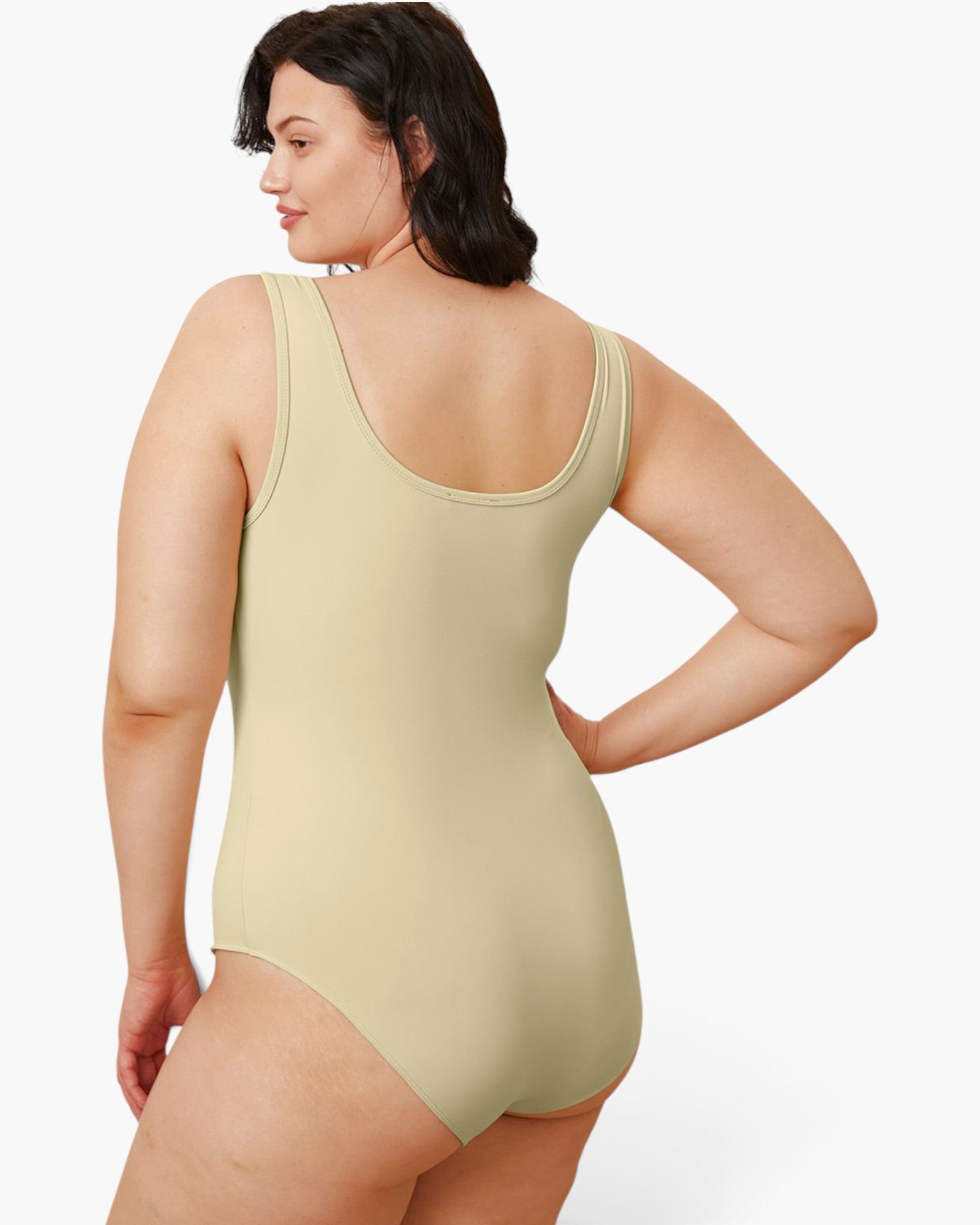 A woman modeling a sleeveless scoop-neck one-piece swimsuit from the back, shown against a plain light gray studio background.