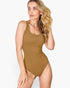 A woman modeling a sleeveless scoop-neck one-piece swimsuit in a solid camel brown color, set against a plain light gray background.