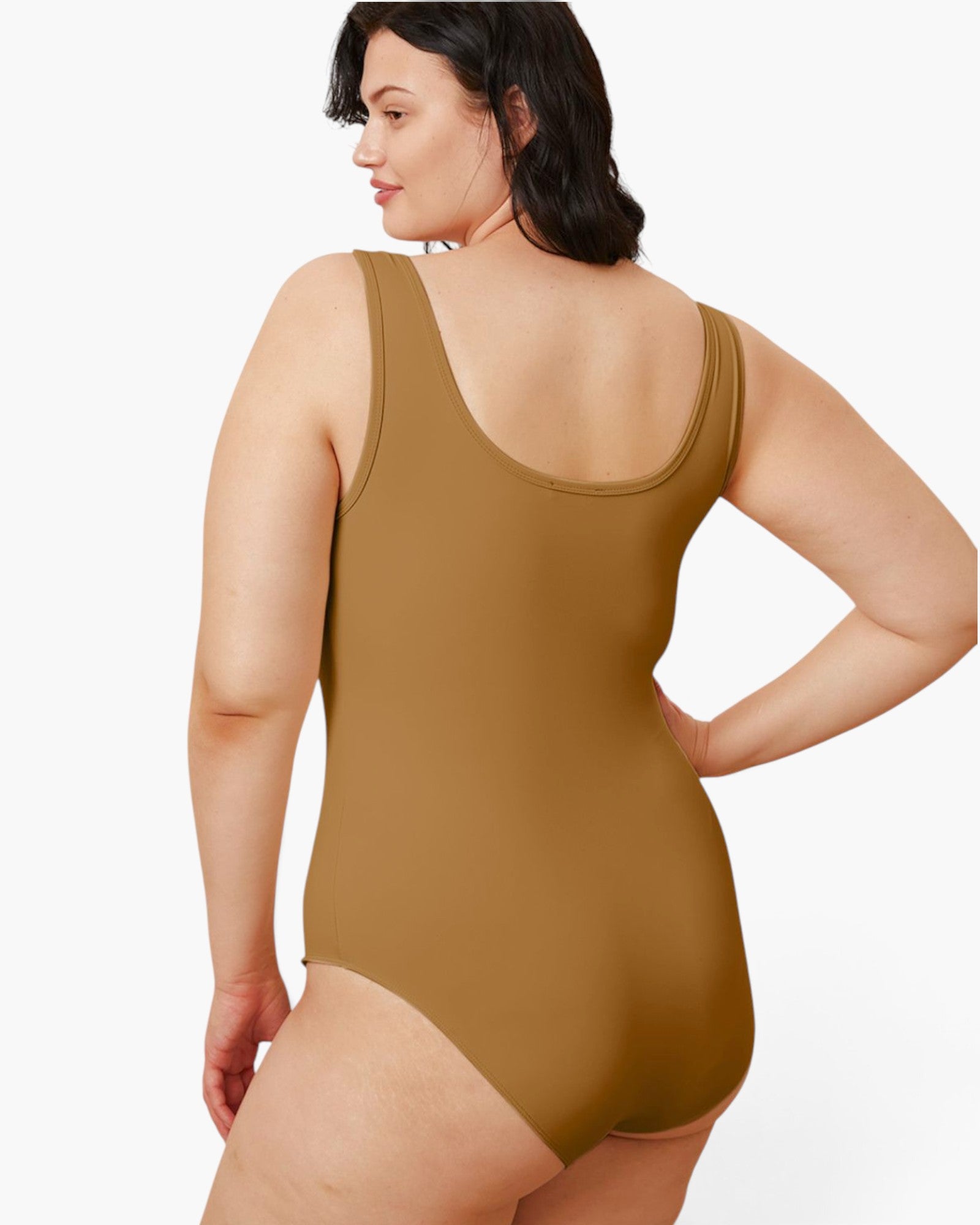 A woman modeling a sleeveless one-piece bodysuit from the back, shown against a plain light gray studio background.