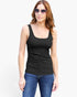 A woman modeling a black scoop-neck tank top with blue jeans and sunglasses against a plain white background.