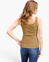 A woman shown from the back wearing a fitted scoop-neck tank top in a warm camel brown color, paired with blue jeans, against a plain white studio background.